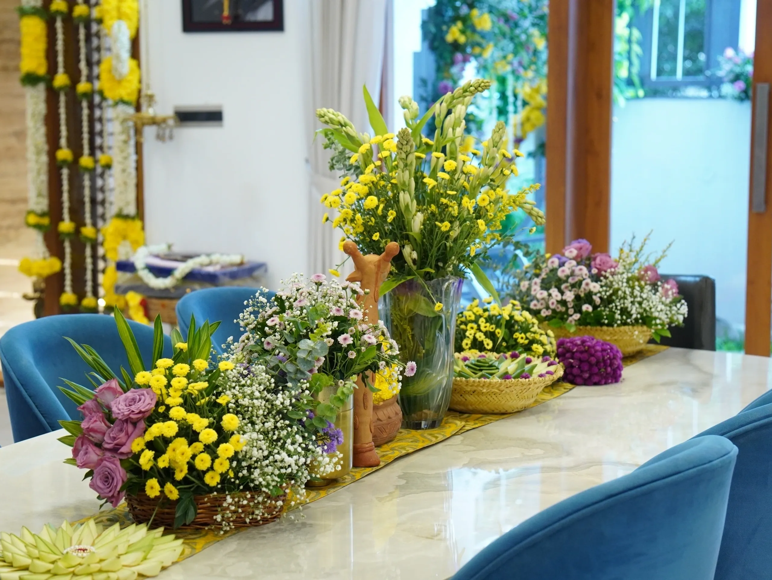 Elegant wedding table decorated with colorful floral arrangements and fresh flowers in Bangalore